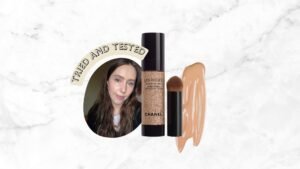 A product shot of the Chanel Les Beiges Water-Fresh Complexion Touch with it&#039;s brush, alongside a picture of Digital Beauty Writer, Naomi wearing it on her face, and a stock image of a foundation swatch and the words &#039;Tried And Tested&#039; on a white and grey marbled template